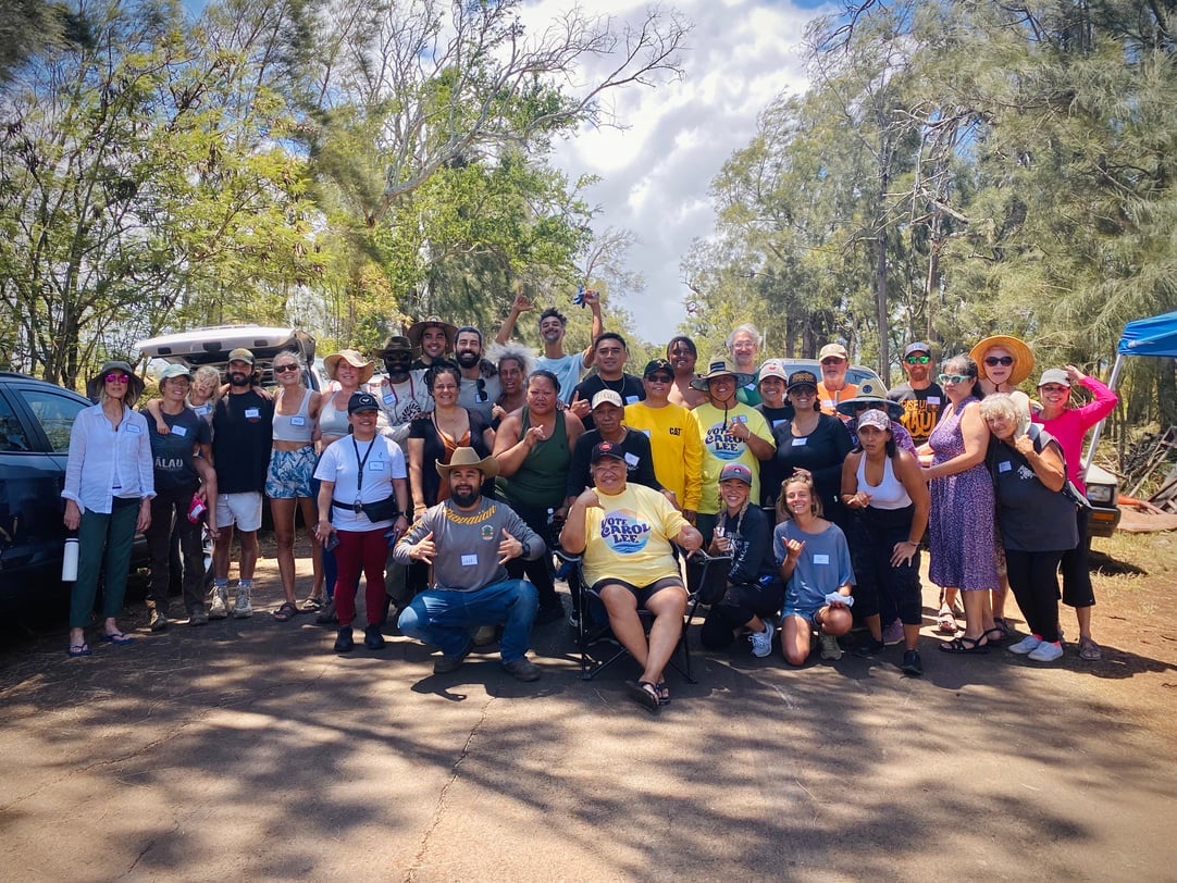 Holomua Outreach volunteers and community members gathered together after a cleanup